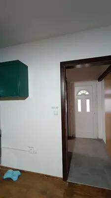 an open door to a room with a white wall at Mountain Home