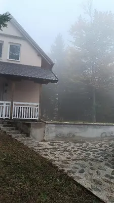 a house on a foggy day with a porch at Mountain Home