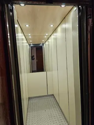 a walk in shower with a mirror in a room at Ramonda Apartment Banja Luka in Banja Luka