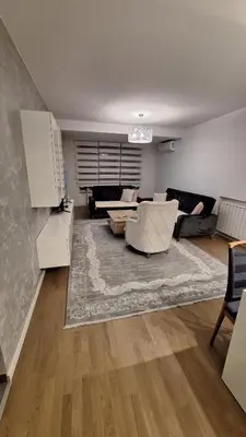 a living room with a couch and a table at Apartman Sunce in Zenica