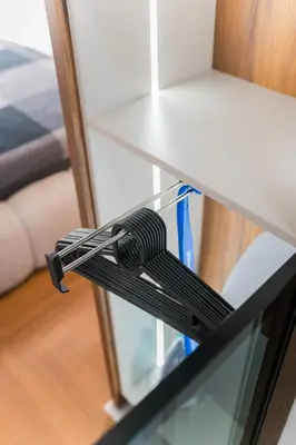 a glass table with a remote control on top of it at Liberty Studio Tuzla in Tuzla