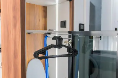 a hose hanging from a door in a room at Liberty Studio Tuzla in Tuzla
