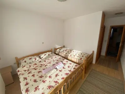 a bedroom with a bed in a room at Pansion Tomas Kupres in Kupres