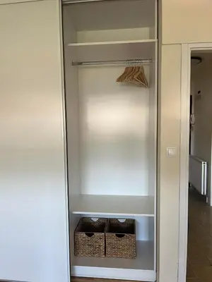 a empty closet with two baskets in it at Stan na dan Kalin in Bugojno
