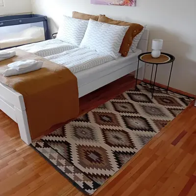 a living room with a couch and a table at Stan na dan Kalin in Bugojno