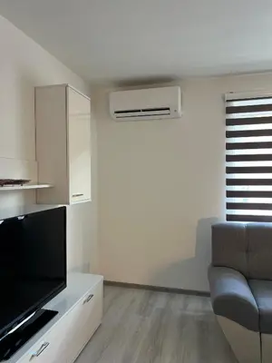 a living room with a flat screen tv and a couch at Apartment Lana Vareš in Vareš