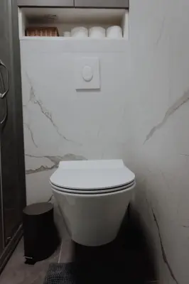 a bathroom with a white toilet in a room at BLuxe Residence in Banja Luka