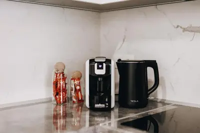 a coffee maker on a counter in a kitchen at BLuxe Residence in Banja Luka
