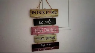 a group of signs hanging on a wall at Vikendica sa bazenom Cazin Pecigrad in Cazin