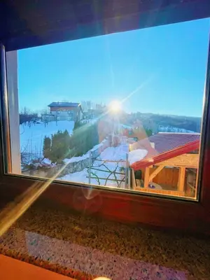 a large window with a view of a river at Vikendica sa bazenom Cazin Pecigrad in Cazin