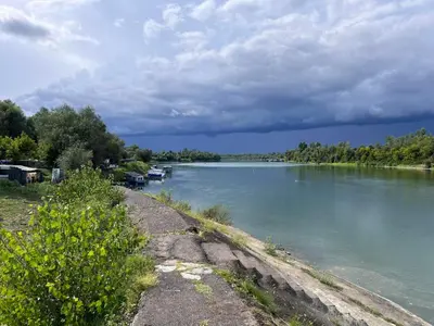 a view of a river with boats in the water at Apartman Čeliković in Bosanski Šamac