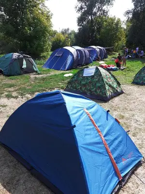 a group of tents sitting on the ground in a field at Apartman Čeliković in Bosanski Šamac