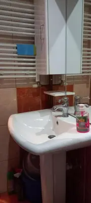a bathroom with a white sink and a mirror at Apartman Jelena Lux in Doboj