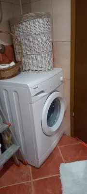 a washing machine with a basket on top of it at Apartman Jelena Lux in Doboj