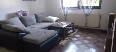 a living room with a couch and a table at Apartman Jelena Lux in Doboj