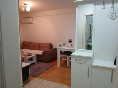 a living room with a couch and a table at Apartman Čakarević in Doboj