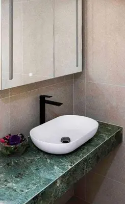 a white sink on a counter in a bathroom at Dream House Banja Luka in Banja Luka