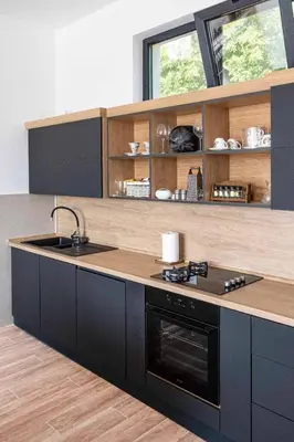 a kitchen with a sink and a stove top oven at Dream House Banja Luka in Banja Luka