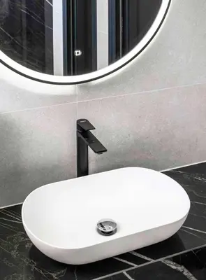 a white sink in a bathroom with a mirror at Dream House Banja Luka in Banja Luka