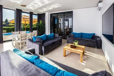 a living room with couches and a table at Dream House Banja Luka in Banja Luka