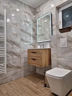 a bathroom with a toilet and a mirror at Vikendica VIA - Čajuša, Kupres in Kupres