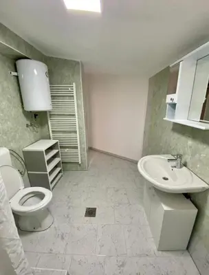 a bathroom with a toilet and a sink at Villa Lilak in Bihać