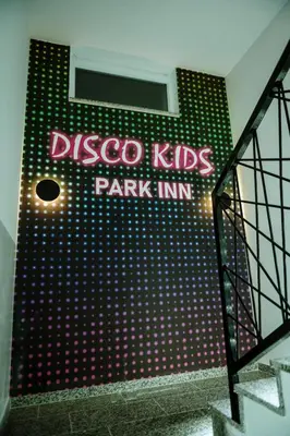 a sign for a disney kids park inn on a wall at PARK INN, Bugojno in Bugojno