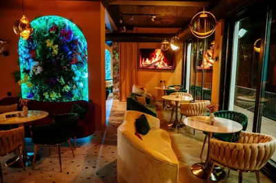 a restaurant with a large aquarium in the middle of the room at PARK INN, Bugojno in Bugojno