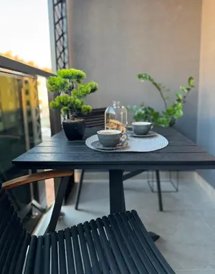 a black table with two cups of coffee on it at Urban Suite BL Apartment in Banja Luka