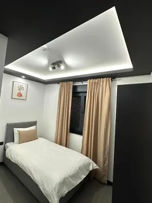 a bedroom with a white bed and a window at Prenoćište Vozač in Jajce