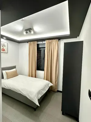 a bedroom with a bed in a room with at Prenoćište Vozač in Jajce