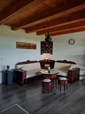 a living room with a couch and a table at Vienna Rem in Lukavac