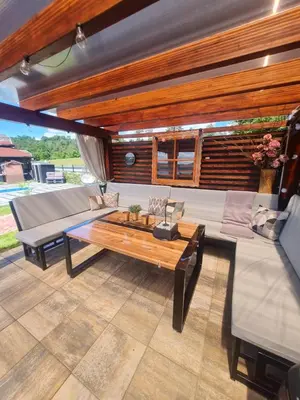 a living room with a couch and a coffee table at Vienna Rem in Lukavac