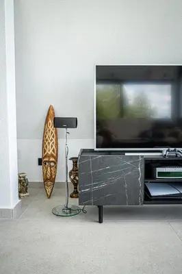 a living room with a flat screen tv on a entertainment center at Villa Gaia Novi Grad