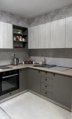 a kitchen with a sink and a stove top oven at Apartman Elite Stay Doboj in Doboj