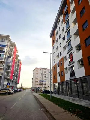 an empty street in a city with buildings at Apartman Elite Stay Doboj in Doboj