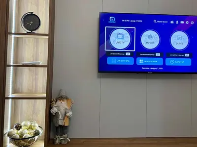 a tv hanging on a wall next to a shelf at FILIP Lux Apartman sa garažom in Doboj