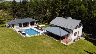 an overhead view of a house with a swimming pool at Villa Bagrem - Villa with private pool in nature in Banja Luka