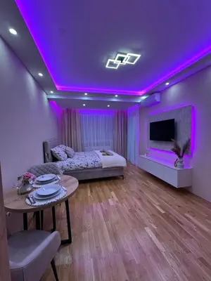 a room with a bed and a purple lighting at Spa Apartman Love&Spa in Železnička Stanica Banja Luka Predgrađe