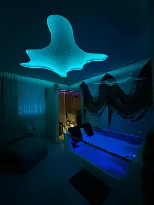 a bedroom with a bed with a star ceiling at Spa Apartman Love&Spa in Železnička Stanica Banja Luka Predgrađe