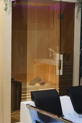 a room with a shower with a sink and a desk at Spa Apartman Love&Spa in Železnička Stanica Banja Luka Predgrađe