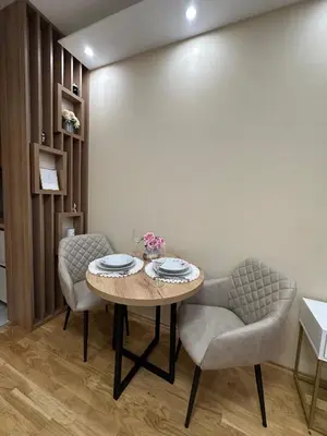 a dining room with a table and two chairs at Spa Apartman Love&Spa in Železnička Stanica Banja Luka Predgrađe
