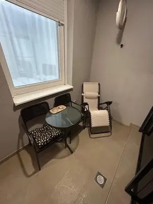 a room with a table and chairs and a window at Moonlight Apartment in Banja Luka