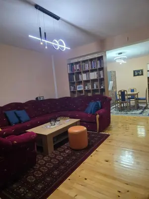 a living room with a couch and a coffee table at Vila Emani in Visoko