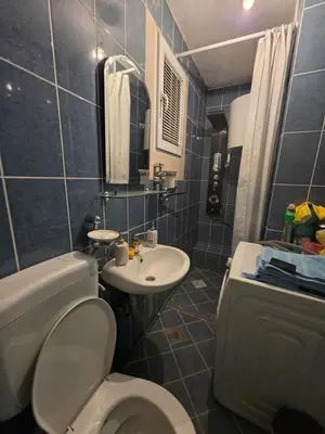 a bathroom with a toilet and a sink at Vila Emani in Visoko