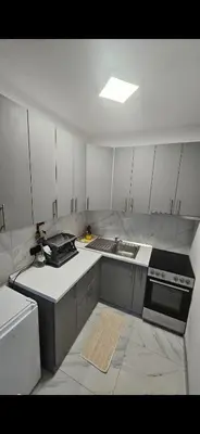 a small kitchen with a sink and a stove at TM Studio Apartment Prijedor in Prijedor