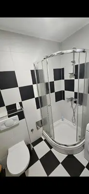 a bathroom with a shower and a toilet and a sink at TM Studio Apartment Prijedor in Prijedor