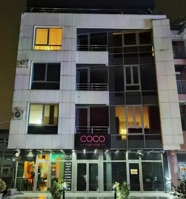 a building with a cacoco sign in front of it at TM Studio Apartment Prijedor in Prijedor