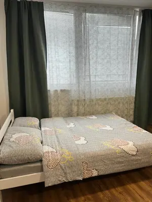 a bed in a bedroom with a window at TM Studio Apartment Prijedor in Prijedor