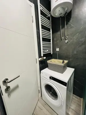 a washing machine in a bathroom with a sink at Apartment Stepanova in Banja Luka